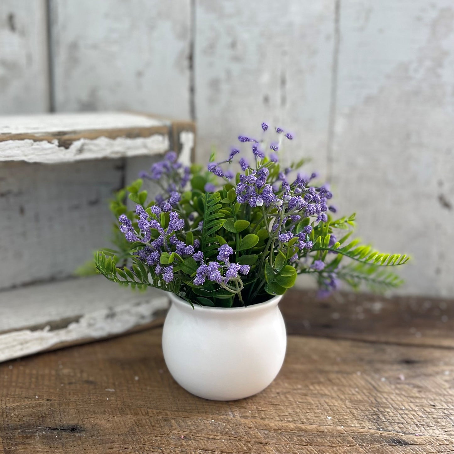 Purple Flowers in White Ceramic Pot